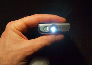 Illustration for article titled Video: Samsung Show W7900 Projector-Packing Cellphone Actually Looks Pretty Cool